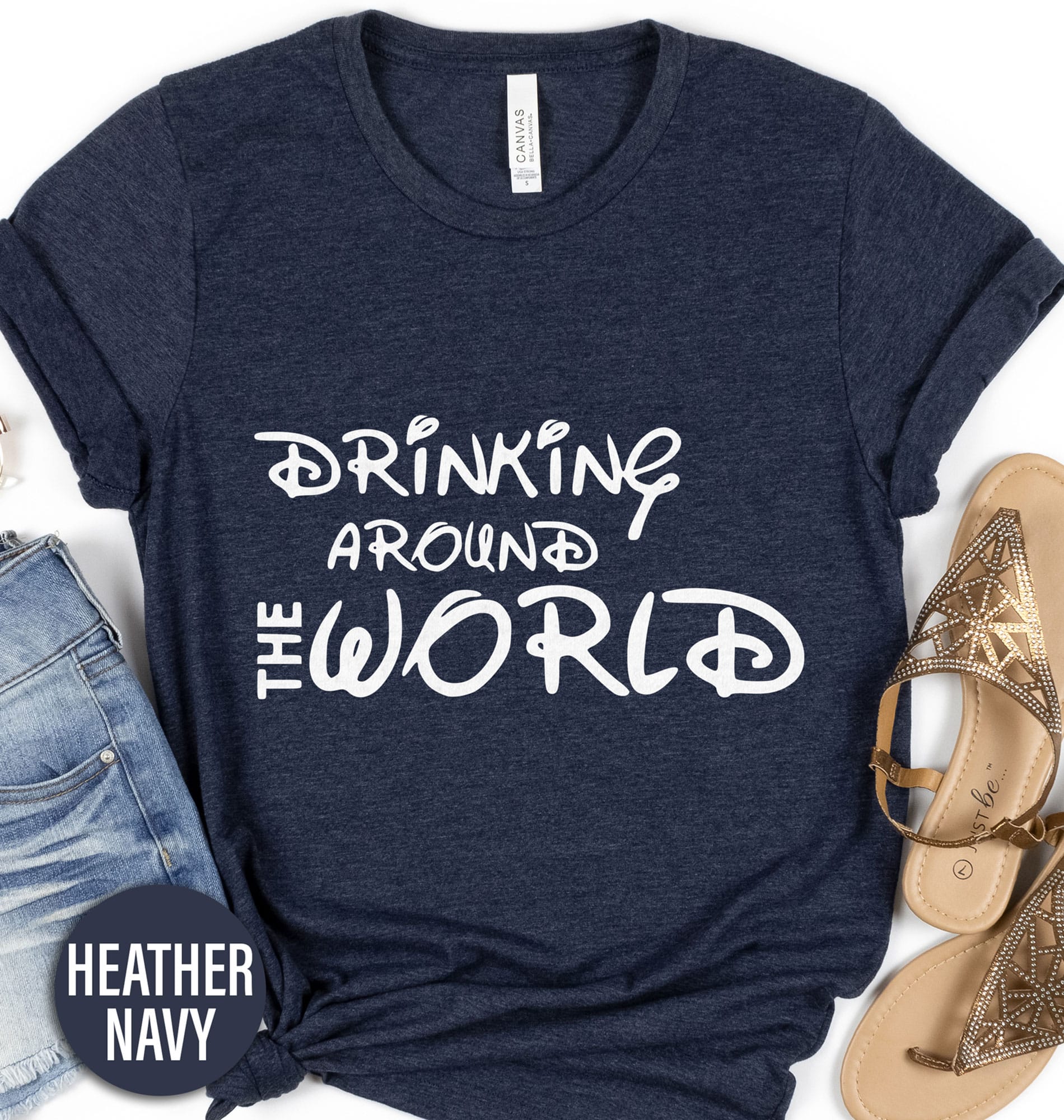 Drinking Around the World Disney Shirt Disney Vacation Shirts Embark on a magical bar crawl with our "Drinking Around the World Disney Shirt" from VacationShirts.com. Perfect for Epcot's International Food and Wine Festival or any Disney pub crawl, this tee celebrates Disney adulting in style. Showcasing vibrant designs of Epcot countries, it's the ultimate Disney vacation drinking outfit. Cheers to adventure!