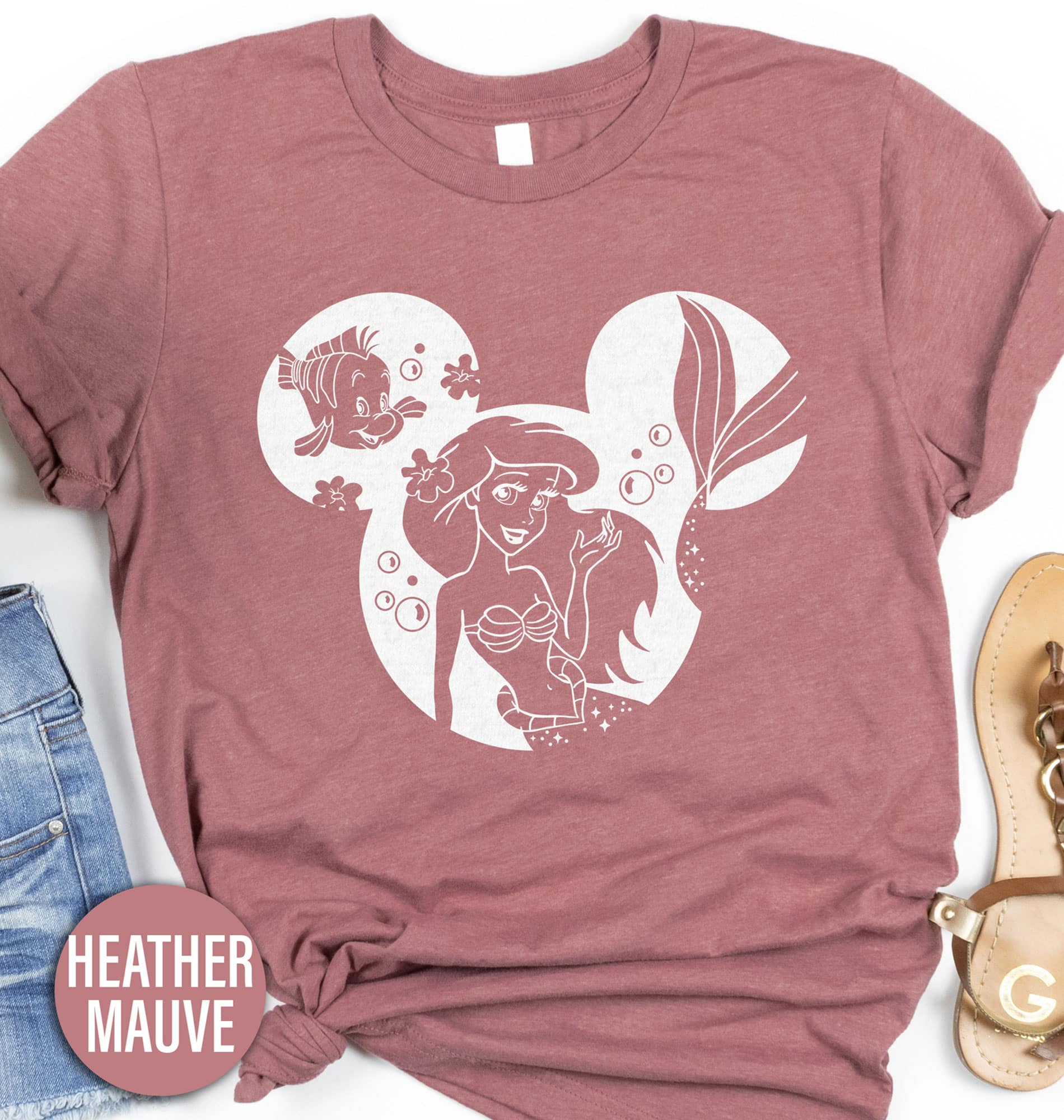 Disney Mermaid Shirt Disney Vacation Shirts Dive into magic with our Disney Mermaid Shirt, featuring enchanting Ariel graphics! Perfect for all ages, this Little Mermaid Apparel blends style with whimsy. Whether you're a kid or an adult, our Ariel T-Shirt is a must-have for any Disney Princess Tee collection. Embrace your inner mermaid with this captivating Ariel Mermaid Top!
