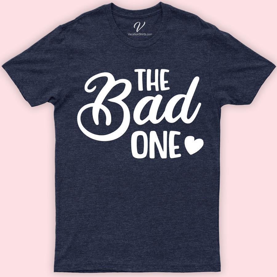 The Bad One Wedding Shirt Wedding Vacation Shirts Unleash the laughter at your wedding with The Bad One Wedding Shirt from VacationShirts.com! Perfect for bachelor parties and groomsmen, this unique wedding attire blends wedding humor with novelty. A creative groom's gift, it's customizable, making every shirt a humorous, memorable addition to your wedding party shirts collection.