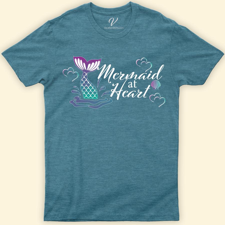 Mermaid at Heart Shirt Beach Vacation Shirts Dive into style with our "Mermaid at Heart" Shirt from VacationShirts.com. Perfect for mermaid lovers, this ocean-inspired apparel blends fantasy mermaid clothing with a whimsical touch. Featuring a captivating mermaid tail design, this aquatic-themed top is a must-have for anyone who adores sea creature fashion and nautical style shirts.