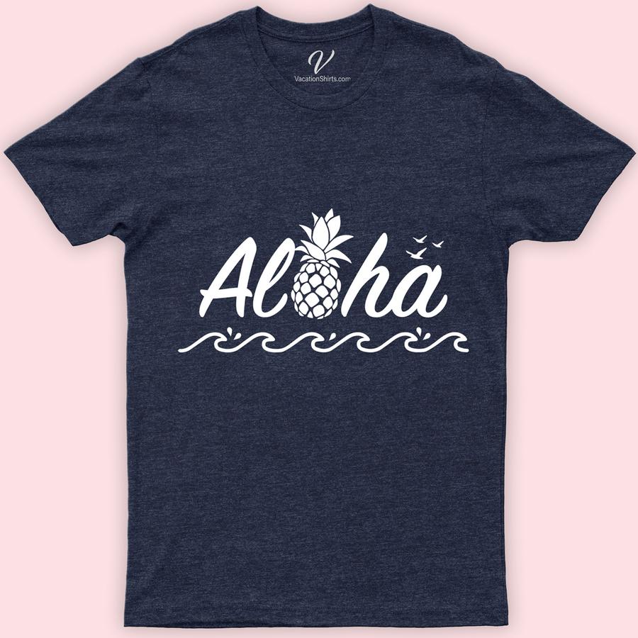 Aloha Waves Hawaii Calligraphy Tee Hawaii Vacation Shirts Embrace the Aloha spirit with our Hawaii Calligraphy Tee! Featuring unique Hawaiian calligraphy and captivating Aloha waves, this shirt embodies tropical elegance. Crafted for beach lovers, our Aloha Graphic Tee merges Hawaiian style with ocean wave charm, making it a must-have for your Hawaiian Islands-inspired wardrobe. Dive into Aloha spirit wear today!