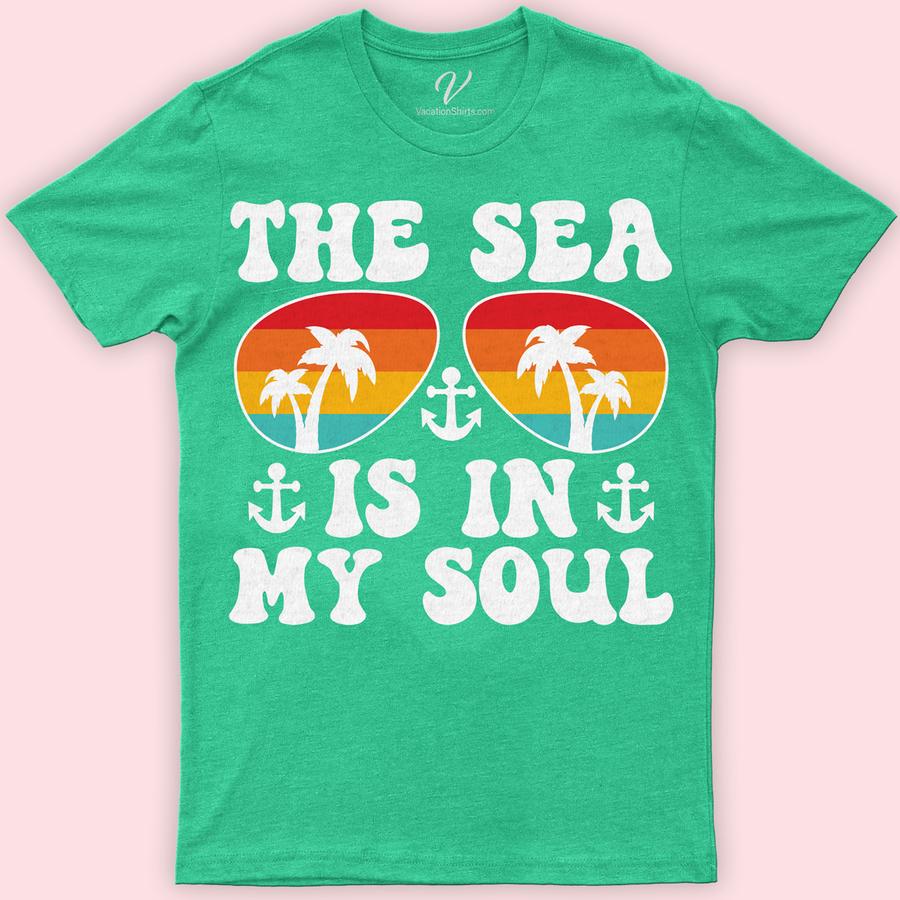 Tropical Palm Sunset & Anchor Graphic 'The Sea Is In My Soul' Vacation Tee Classic Vacation Shirts Embrace the essence of summer with our Tropical Palm Sunset & Anchor Graphic Tee. Perfect for beach lovers, this 'The Sea Is In My Soul' vacation shirt blends nautical charm and coastal fashion. Featuring a stunning palm sunset and anchor design, it's the ultimate ocean-inspired, sailing motif apparel for your next holiday.