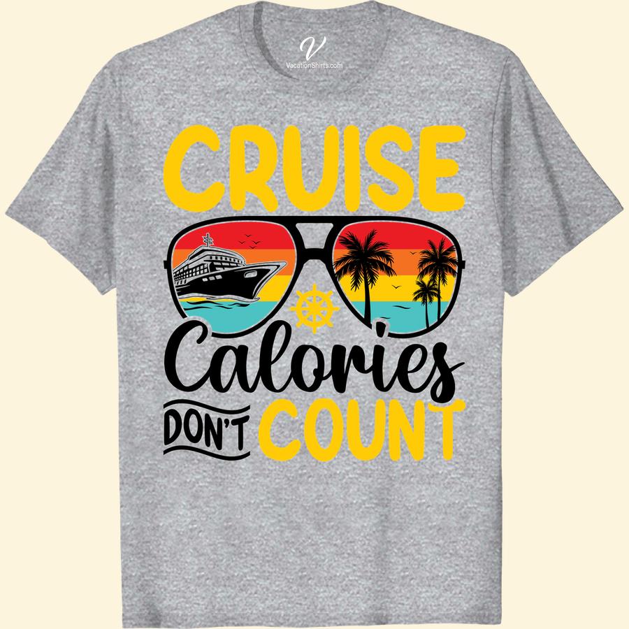 Cruise Calories Tee: Sunset, Palm Trees & Ship Wheel Design Set sail in style with our Cruise Calories Tee, featuring a stunning sunset design backdropped with iconic palm trees. This nautical themed tee is the ideal sea vacay apparel; its ship wheel t-shirt design adds a unique touch. Our summer cruise shirts are the perfect travel inspired tees for any tropical vacation.